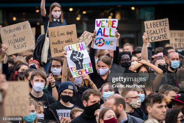 People protest against racism and police brutality and pay tribute to George Floyd in Alexanderplatz in Berlin, Germany on June 06, 2020. About...