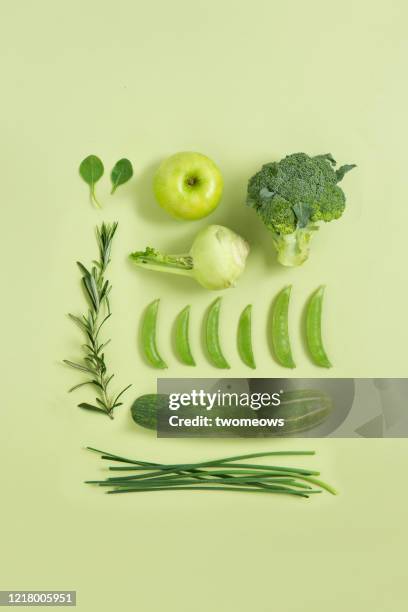 green colour vegan food still life image. - green apple slices stock pictures, royalty-free photos & images