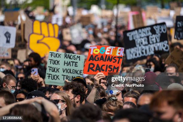 People protest against racism and police brutality and pay tribute to George Floyd in Alexanderplatz in Berlin, Germany on June 06, 2020. About...