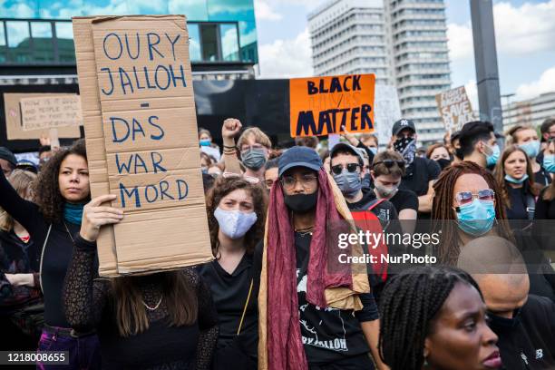 People protest against racism and police brutality and pay tribute to George Floyd in Alexanderplatz in Berlin, Germany on June 06, 2020. About...