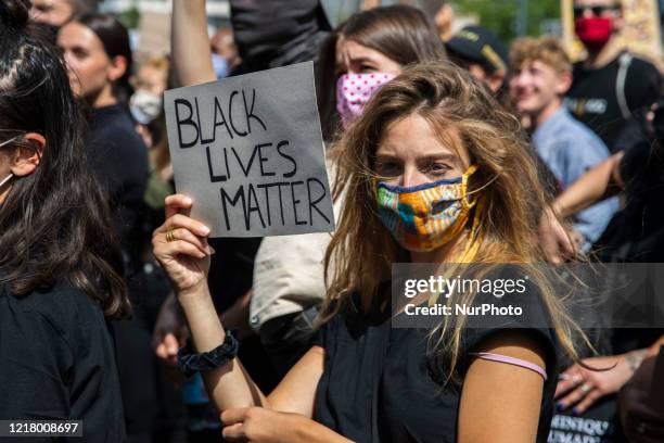 People protest against racism and police brutality and pay tribute to George Floyd in Alexanderplatz in Berlin, Germany on June 06, 2020. About...