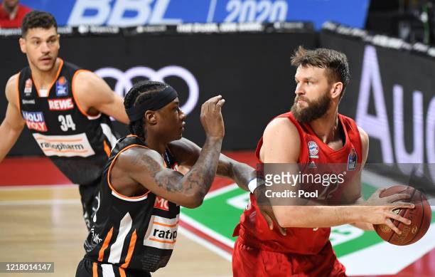 Danilo Barthel of FC Bayern Muenchen is challenged by Archie Goodwin of Ratiopharm Ulm during the EasyCredit Basketball Bundesliga match between FC...