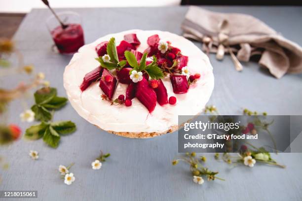 cheesecake with roasted red rhubarb and wild strawberry - rhubarb cheesecake stock pictures, royalty-free photos & images