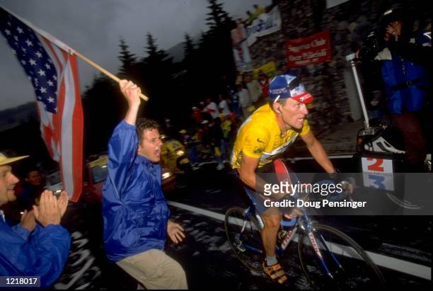 Lance Armstrong of the USA and Team USP cheered on by a patriotic fan during Stage 9 of the Tour de France between Le Grand-Bornand and Sestrieres. \...