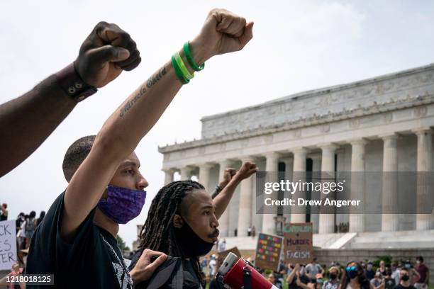 Demonstrators march past the Lincoln Memorial during a protest against police brutality and racism takes place on June 6, 2020 in Washington, DC....