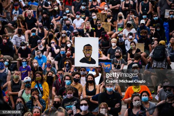Thousands of people listen as Denver Broncos players speak at a protest for the death of George Floyd on June 6, 2020 in Denver, Colorado. This is...