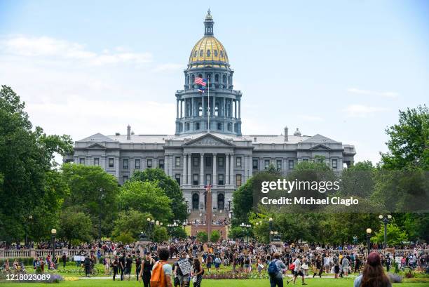 People protest in front of the Colorado State Capitol on June 6, 2020 in Denver, Colorado. This is the 12th day of protests since George Floyd died...