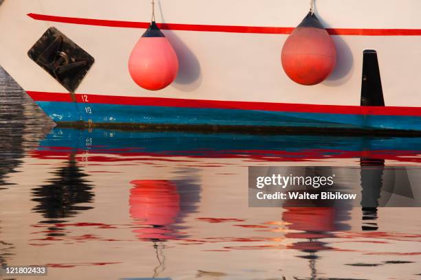 italy, sardinia, northern sardinia, palau, boat reflection - insel maddalena stock-fotos und bilder