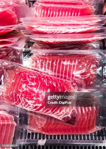 slices of raw ham packed in vacuum packages - vacuum packed stock pictures, royalty-free photos & images