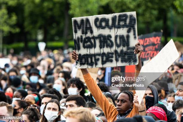 People protest against racism and police brutality in Paris on June 6 as part of 'Black Lives Matter' worldwide protests against racism and police...