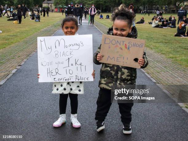 Kids hold placards during the demonstration. Around 5000 People gathered in Cambridge, to hold a peaceful demonstration as part of a worldwide Black...