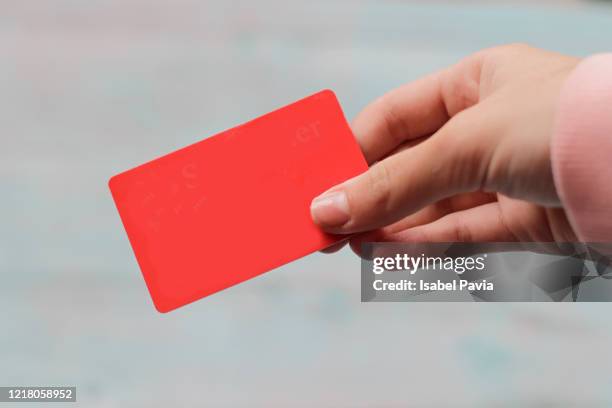 hands holding credit card - hand holding credit card stock pictures, royalty-free photos & images