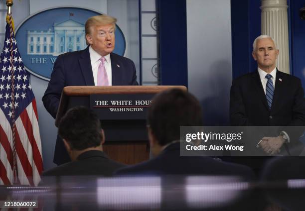 President Donald Trump speaks during the daily briefing of the White House Coronavirus Task Force as US Vice President Mike Pence looks on in the...