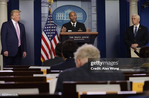Surgeon General Jerome Adams speaks as U.S. President Donald Trump and Vice President Mike Pence look on during the daily briefing of the White House...