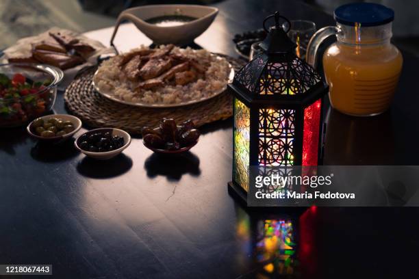 ramadan fanous at table with iftar - iftar photos et images de collection