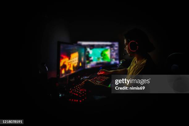 cyber sport. team play. professional cybersport player training or playing online game on his pc - gaming championship stock pictures, royalty-free photos & images
