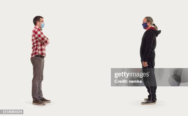 people with medical mask avoiding physical contact, 2m or 6ft - two meters stock pictures, royalty-free photos & images