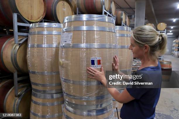 Winemaker Yvonne Lester inspects newly-arrived French oak wine casks in the midst of the harvest season at the Rupert & Rothschild Vignerons estate...