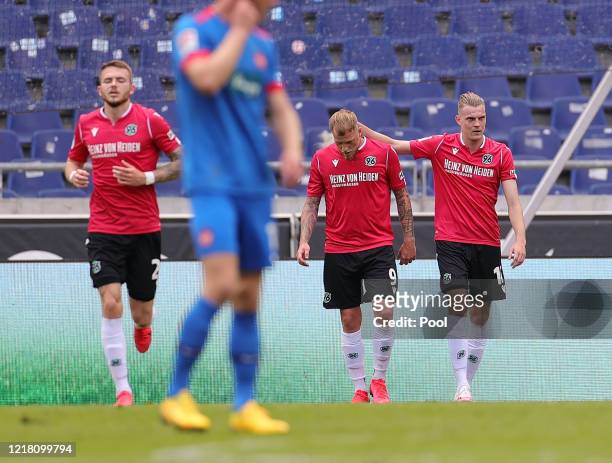 Marvin Ducksch of Hannover 96 celebrates with John Guidetti after scoring his team's first goal during the Second Bundesliga match between Hannover...