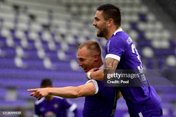 Florian Kruger of Aue celebrates after scoring his teams first goal with his teammates Pascal Testroet from Aue during the Second Bundesliga match...