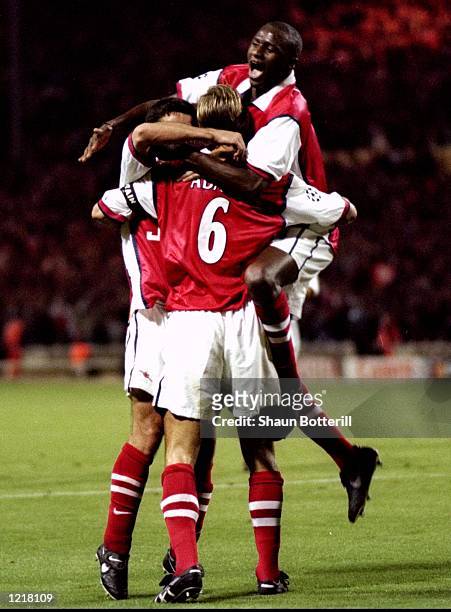 Tony Adams of Arsenal is congratulated by his team-mates after scoring a goal during the UEFA Champions League match against Panathinaikos played at...