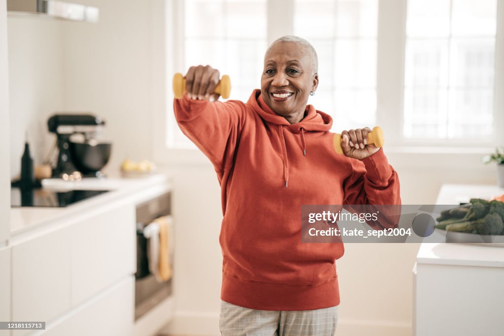 Senior women exercising at home