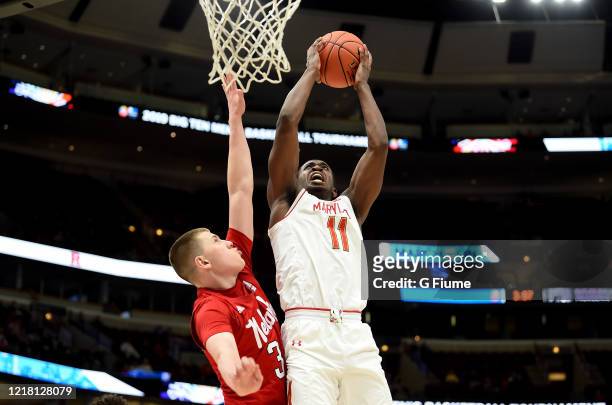 Darryl Morsell of the Maryland Terrapins drives to the hoop against the Nebraska Cornhuskers in the Second Round of the Big Ten Basketball Tournament...
