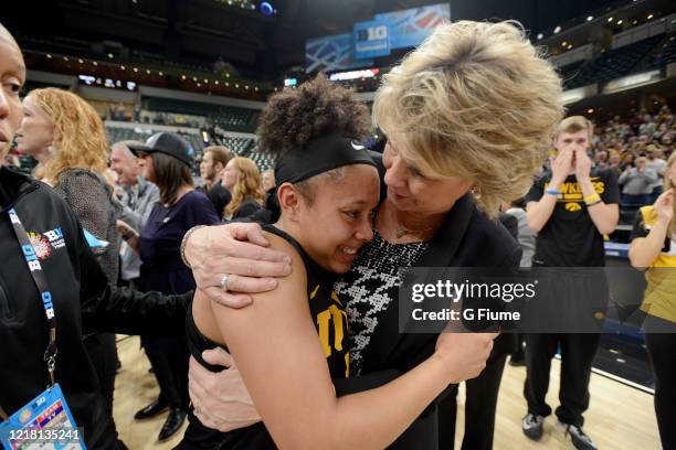 Head Coach Lisa Bluder of the Iowa Hawkeyes celebrates with Tania Davis after winning the 2019 BIG Ten Women's Basketball Championship against the...