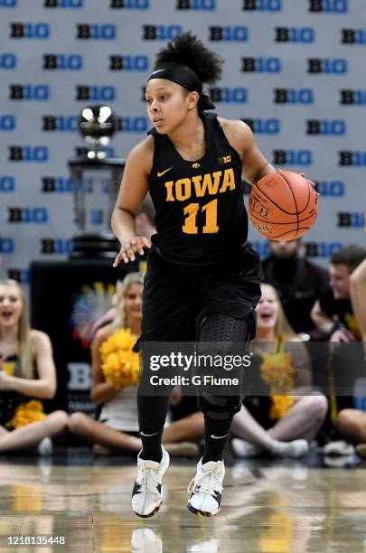 Tania Davis of the Iowa Hawkeyes handles the ball against the Maryland Terrapins during the 2019 BIG Ten Women's Basketball Championship game at...