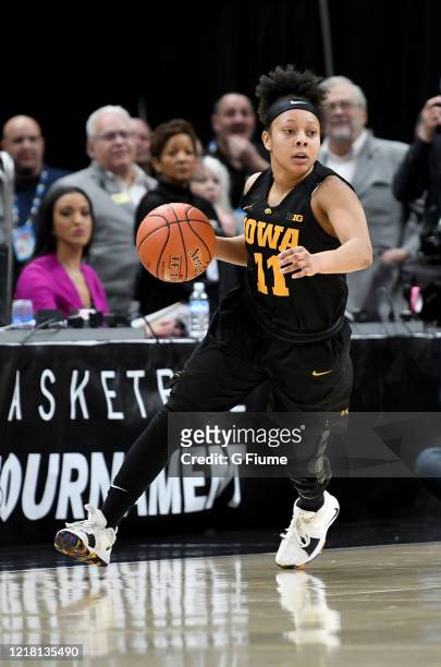 Tania Davis of the Iowa Hawkeyes handles the ball against the Maryland Terrapins during the 2019 BIG Ten Women's Basketball Championship game at...