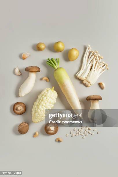 white and brown colour vegan food still life image. - enoki mushroom stock pictures, royalty-free photos & images