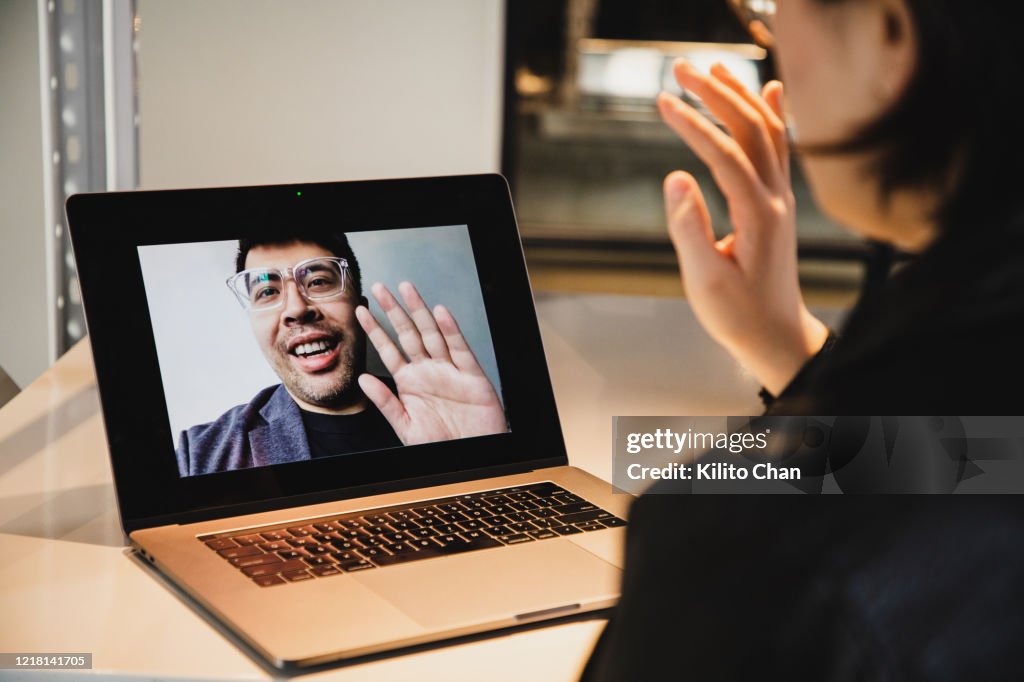 Asian woman video conference with asian man