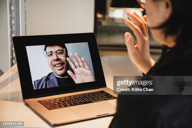 asian woman video conference with asian man - covid dating stock pictures, royalty-free photos & images