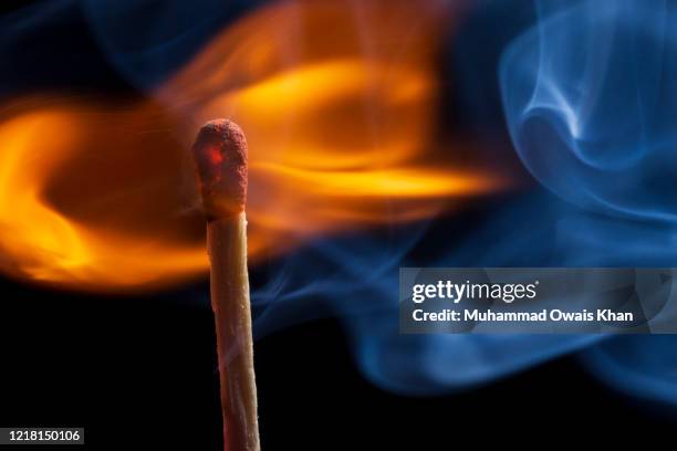 close-up of burning matchstick - arson stock pictures, royalty-free photos & images