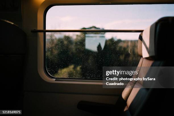 window train views with rain and light reflects - bus window stock pictures, royalty-free photos & images