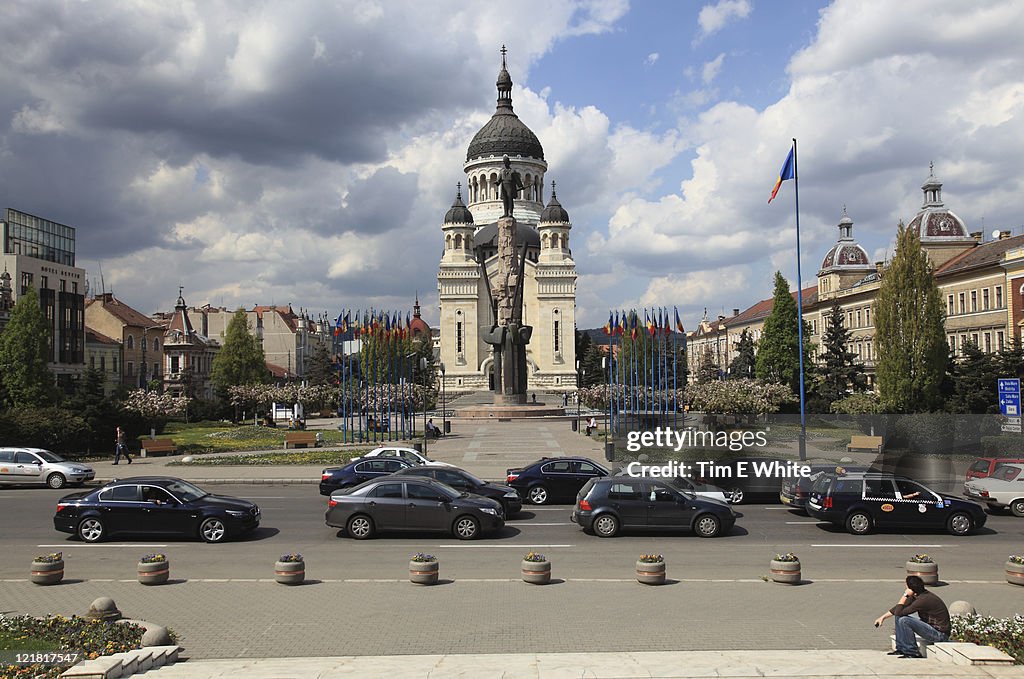 Central square with orthodox church and statue, Cluj Napoca, Romania