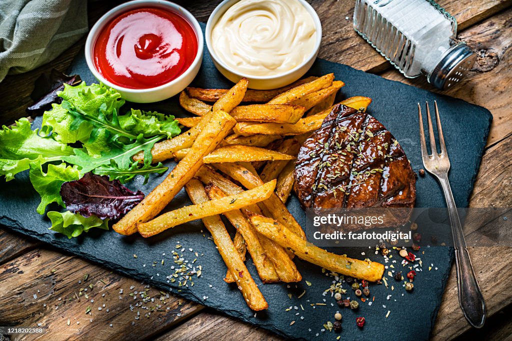 Grilled tenderloin with French fries and salad