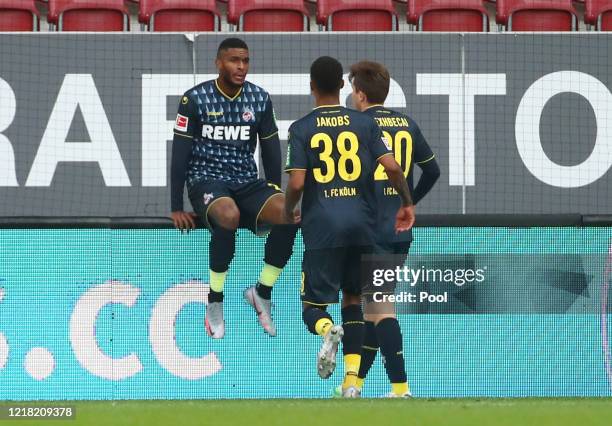 Anthony Modeste of 1. FC Koeln celebrates with his team mates after scoring his team's first goal during the Bundesliga match between FC Augsburg and...