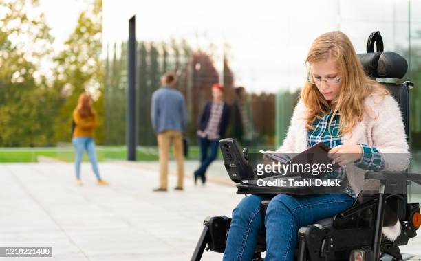 college friends standing outdoors on campus - motorized wheelchair stock pictures, royalty-free photos & images