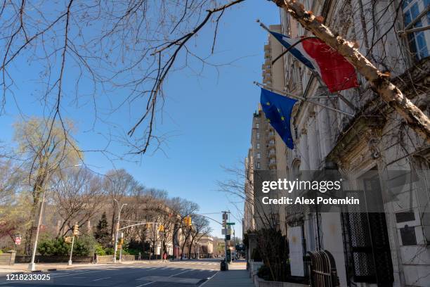 france and eu flags flying above the closed entrance to the france embasssy on fifth avenue - french consulate stock pictures, royalty-free photos & images