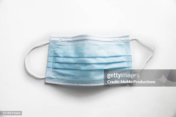 surgical mask on white background - crime or recreational drug or prison or legal trial fotografías e imágenes de stock