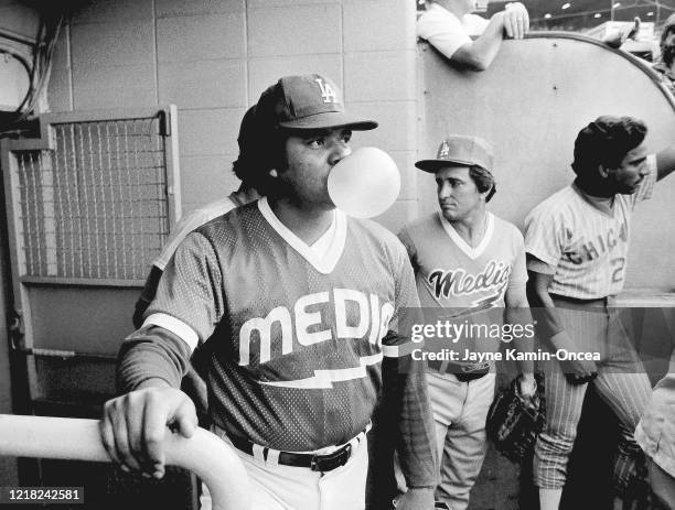 Fernando Valenzuela of the Los Angeles Dodgers waits in the dugout as a member of the Media team during the Hollywood Stars game Dodger Stadium, Los...