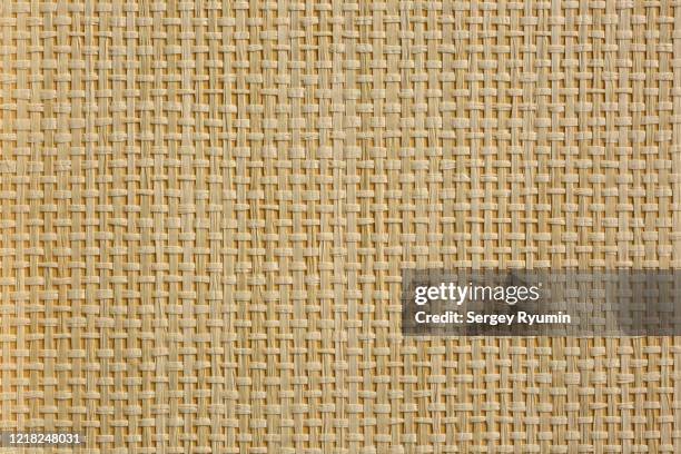 wicker straw on cardboard - background - straw foto e immagini stock