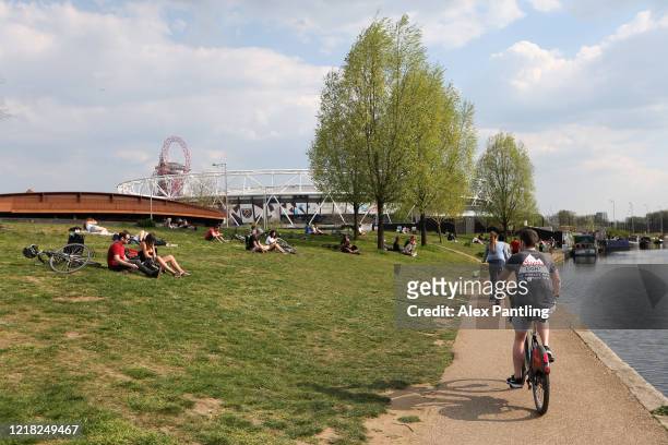 General view as the people sit and enjoy the sun at Queen Elizabeth Olympic Park on April 11, 2020 in London, England. Public Easter events have been...