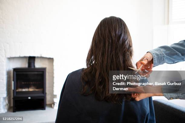 a woman cutting a woman's hair - new hairstyle stock pictures, royalty-free photos & images