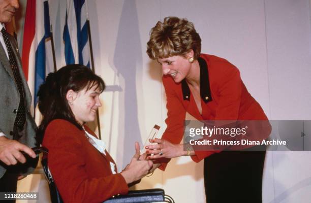 Diana, Princess of Wales hands out a prize at the Children of Europe Awards at the Savoy Hotel in London, 4th March 1992.