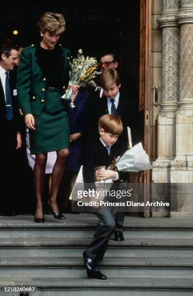 Diana, Princess of Wales , Prince William and Prince Harry visit the Natural History Museum in London, April 1992. Diana is wearing a green suit by...