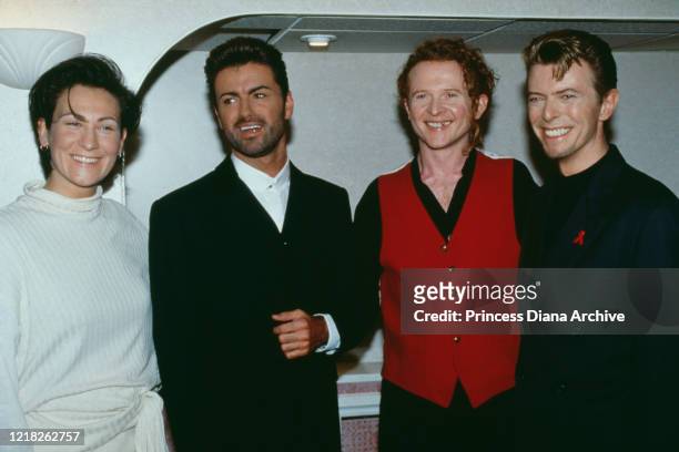 From left to right, singers k.d.lang, George Michael, Mick Hucknall and David Bowie at Wembley Arena in London, for the Concert of Hope, a benefit...