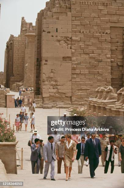 Diana, Princess of Wales visits the ancient temple complex in Karnak, part of the city of Luxor in Egypt, 14th May 1992. She is walking past the...