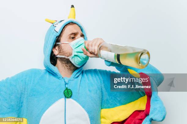 man disguised as chicken and wearing a mask and wine - funny surgical masks stock pictures, royalty-free photos & images